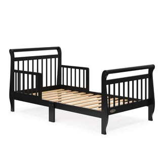 black toddler bed with guardrails and without mattress