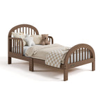 Olivia hazelnut toddler bed with bedding angle view