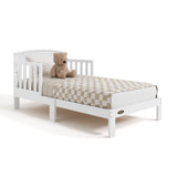 Benton white toddler bed with bedding angle view