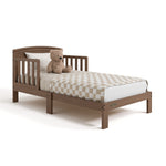 Benton hazelnut toddler bed with bedding angle view
