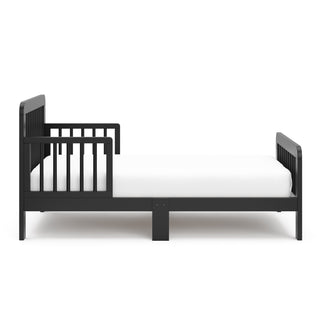 side view of black toddler bed