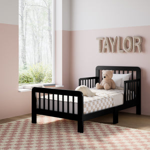 Black toddler bed angled view in kids bedroom 