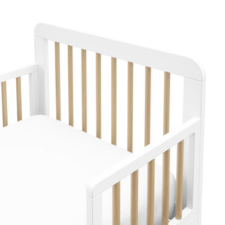close-up view of white with driftwood toddler bed's headboard