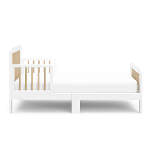 side view of white with driftwood toddler bed