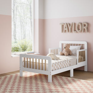 white with driftwood toddler bed angled view in kids bedroom 