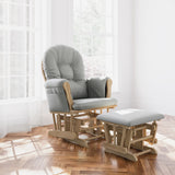 storkcraft hoop glider and ottoman natural frame with light gray cushions in nursery in front of windows