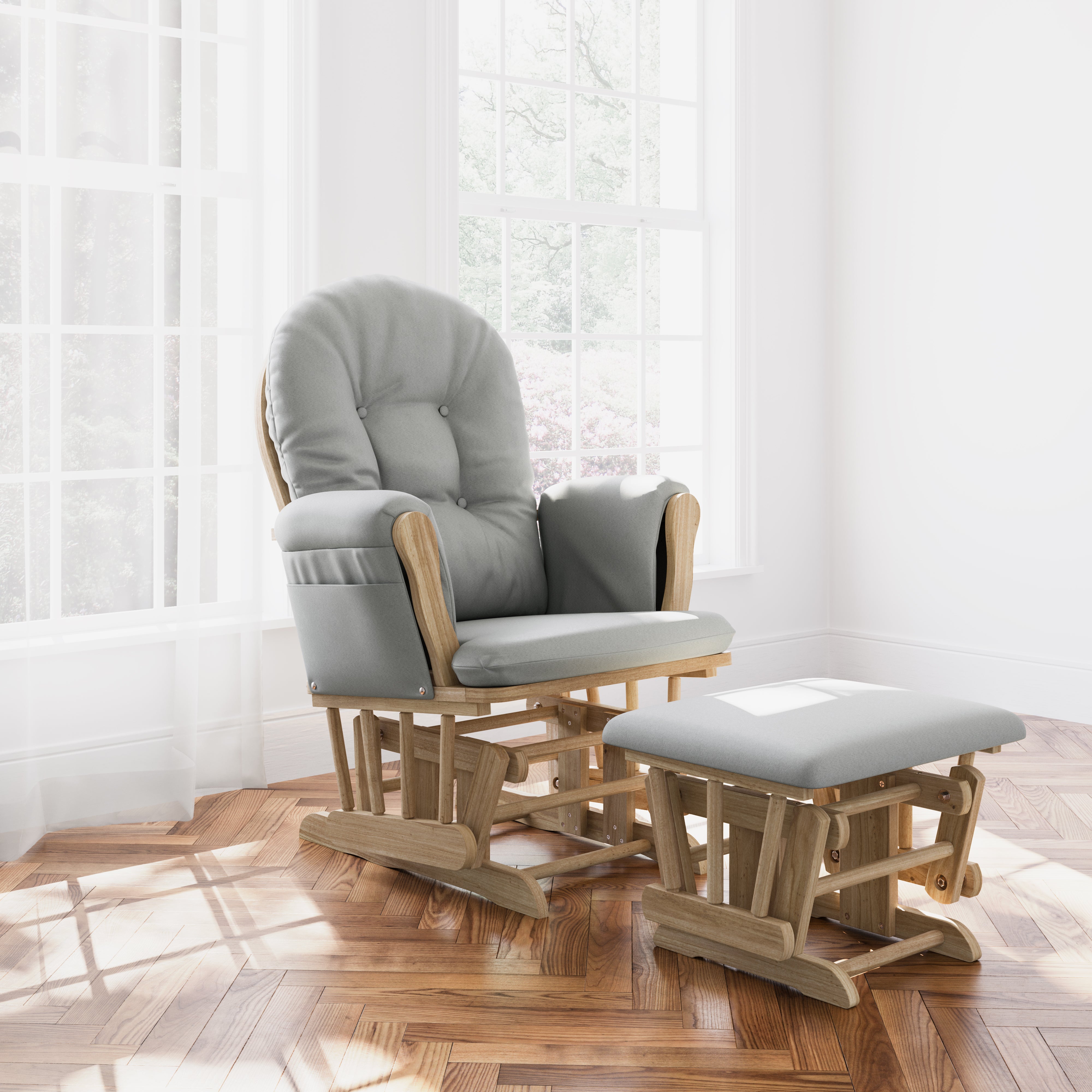 storkcraft hoop glider and ottoman natural frame with light gray cushions in nursery in front of windows