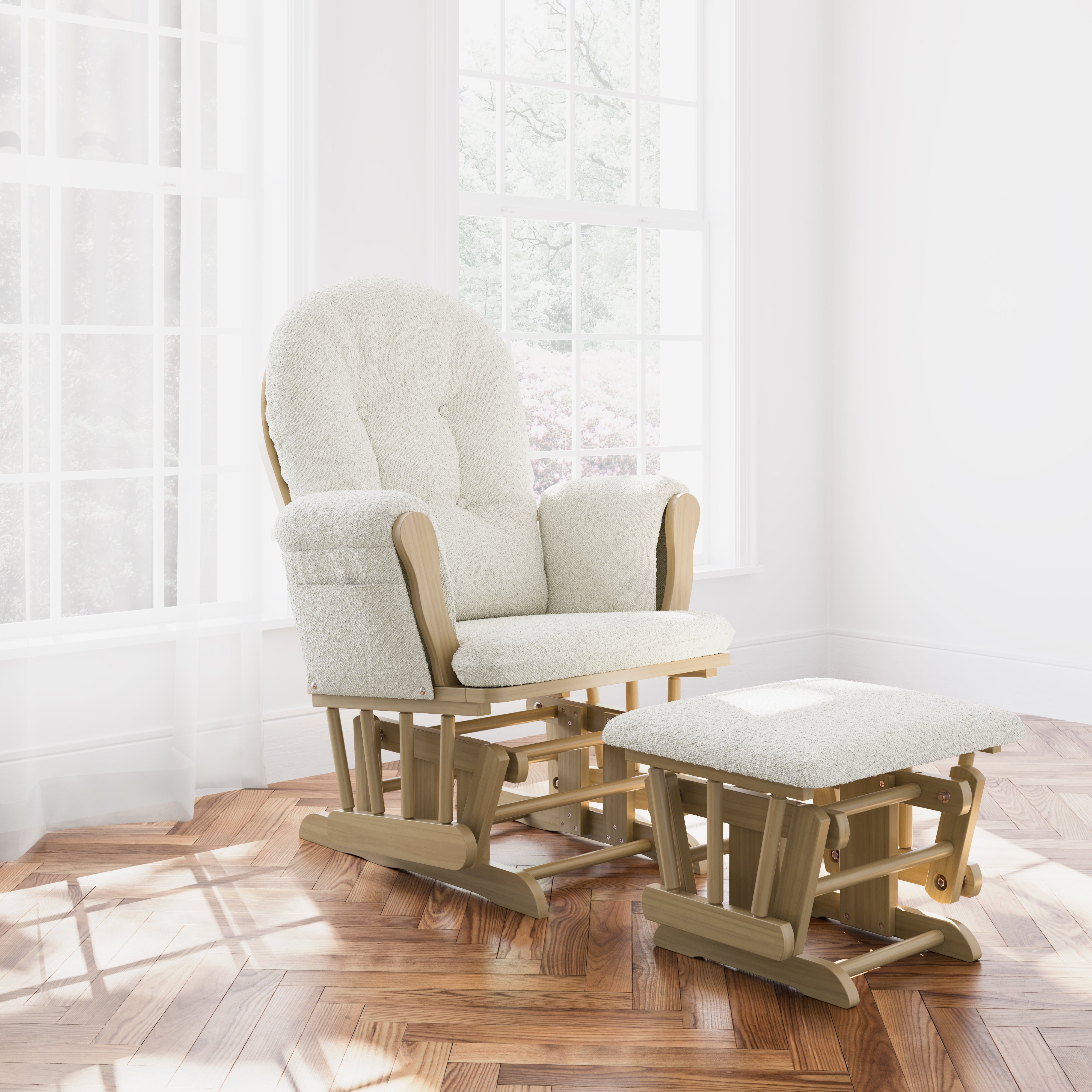 Hoop driftwood with ivory boucle glider and ottoman in a nursery