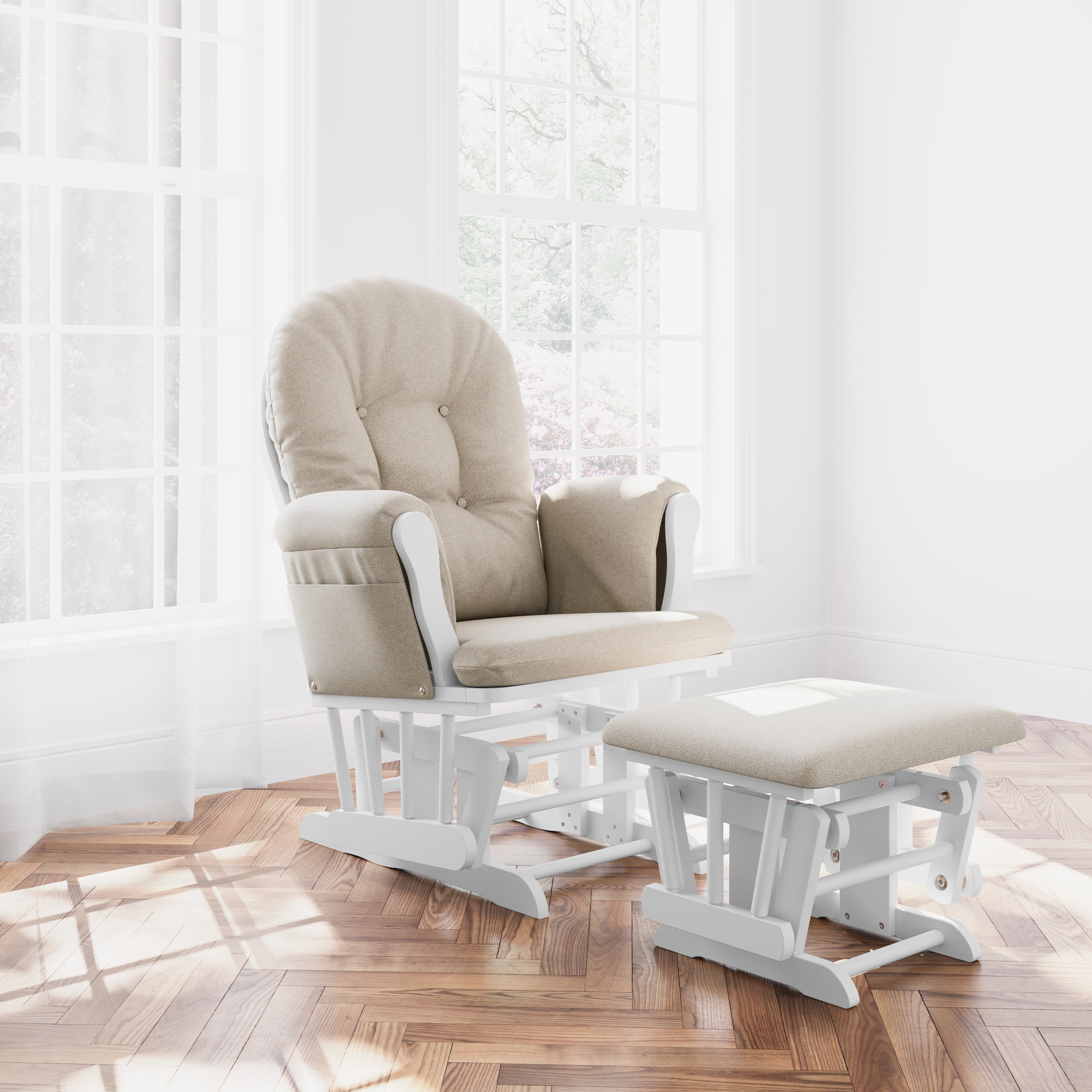 storkcraft hoop glider and ottoman white frame with taupe swirl cushions in nursery in front of windows