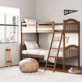 storkcraft long horn hazelnut twin over twin bunk bed in kids room by window