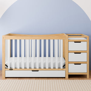 white with natural crib with drawer and changer in nursery