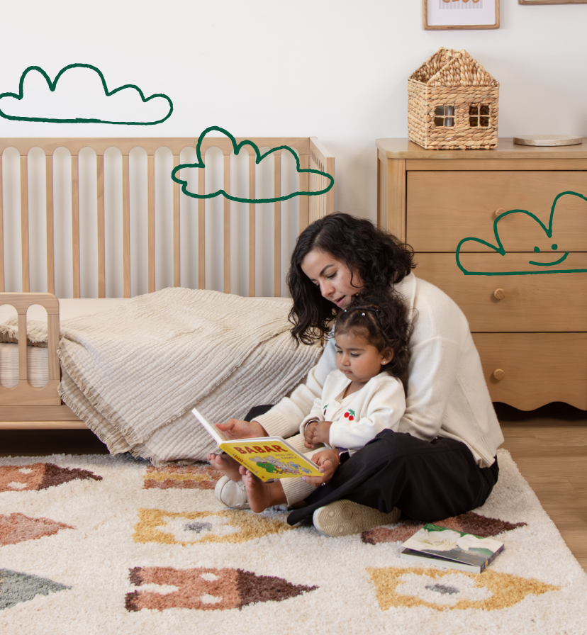 Image of mother and toddler in nursery bonding and reading together.