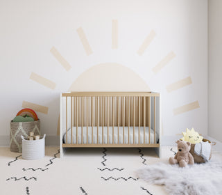 white with driftwood crib in nursery