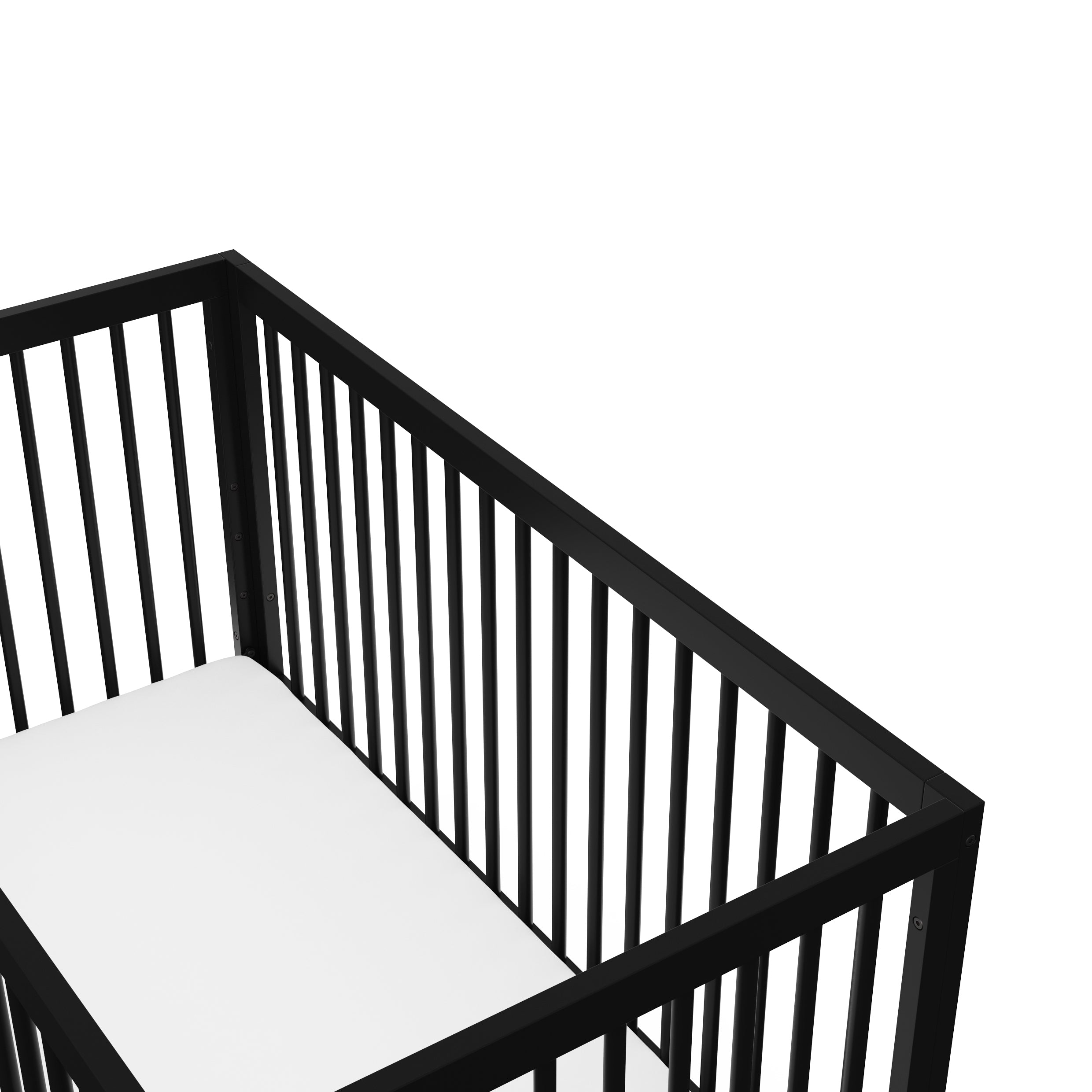 Birds-eye angled view of black baby crib