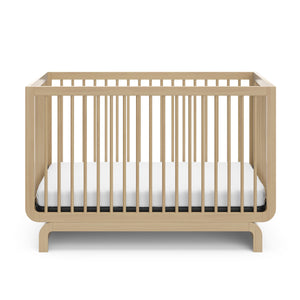 Natural wood baby crib, at a front-facing angle