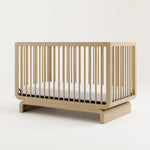 Storkcraft® Santorini® Deluxe 5-in-1 Convertible Crib with Bonus Toddler Guardrail.