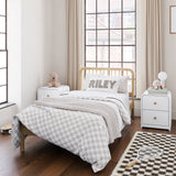 Two santos white nightstands with bed in the middle inside kids room