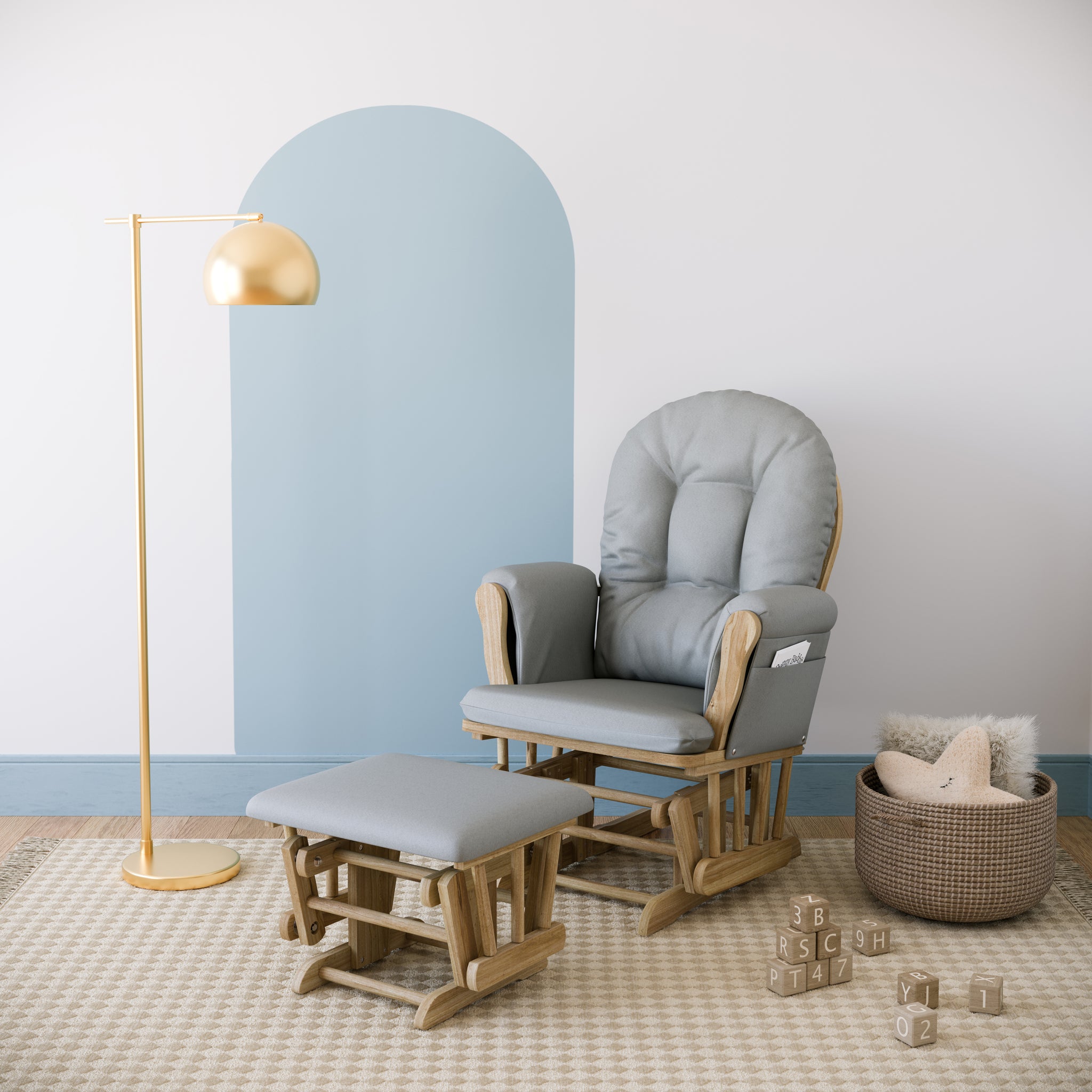 Nursery rocking chair and ottoman in natural wood color with light gray cushions, in bedroom setting against wall with light blue arch shape wallpaper