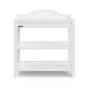 Front view of white changing table with storage