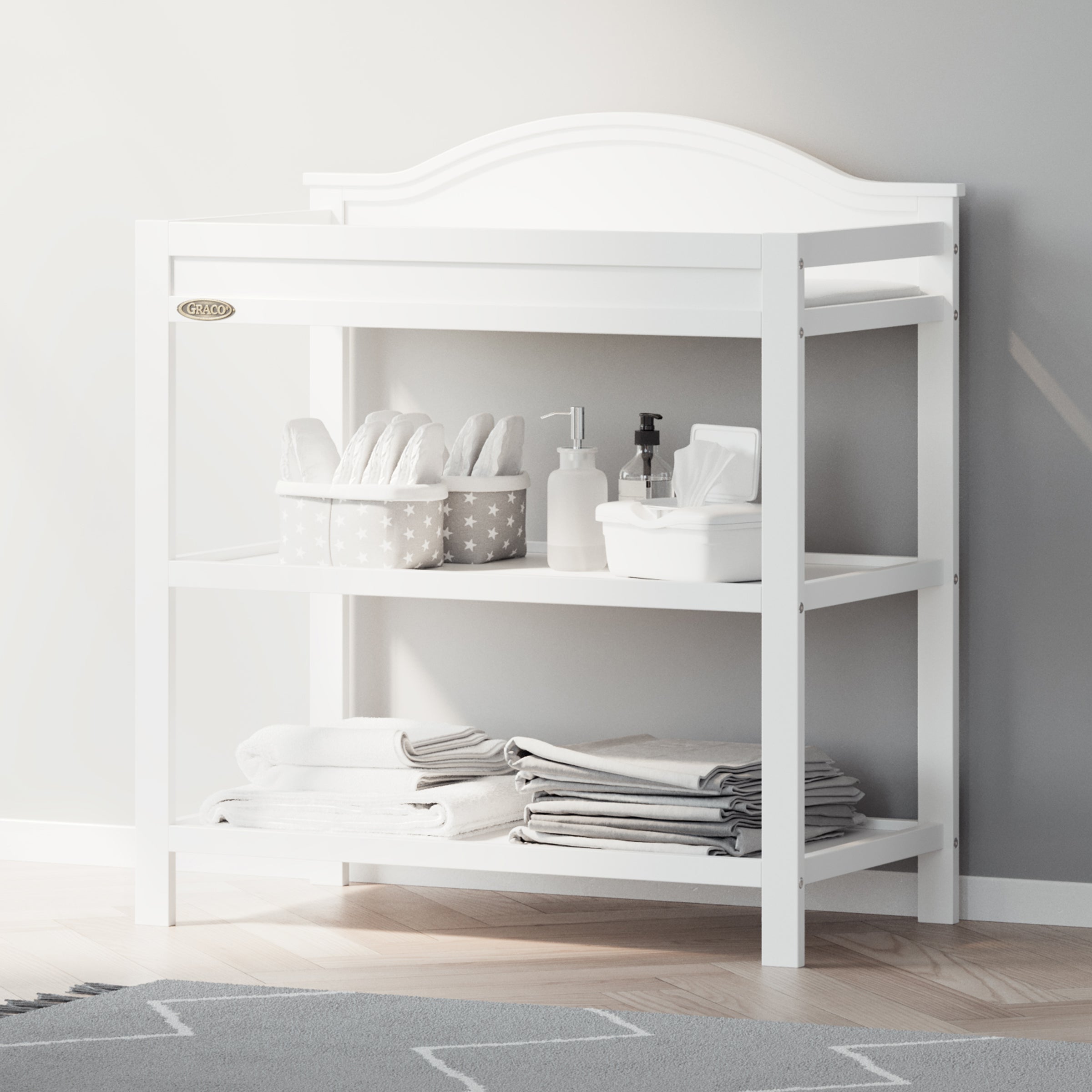 Graco® Story Changing Table with Bonus Water-Resistant Changing Pad.