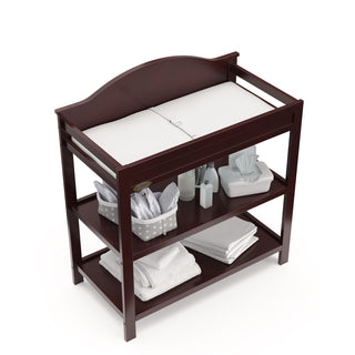 Bird’s-eye view of espresso changing table with two open shelves