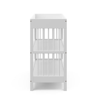 side view white changing table with two shelves