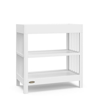 white changing table with two shelves