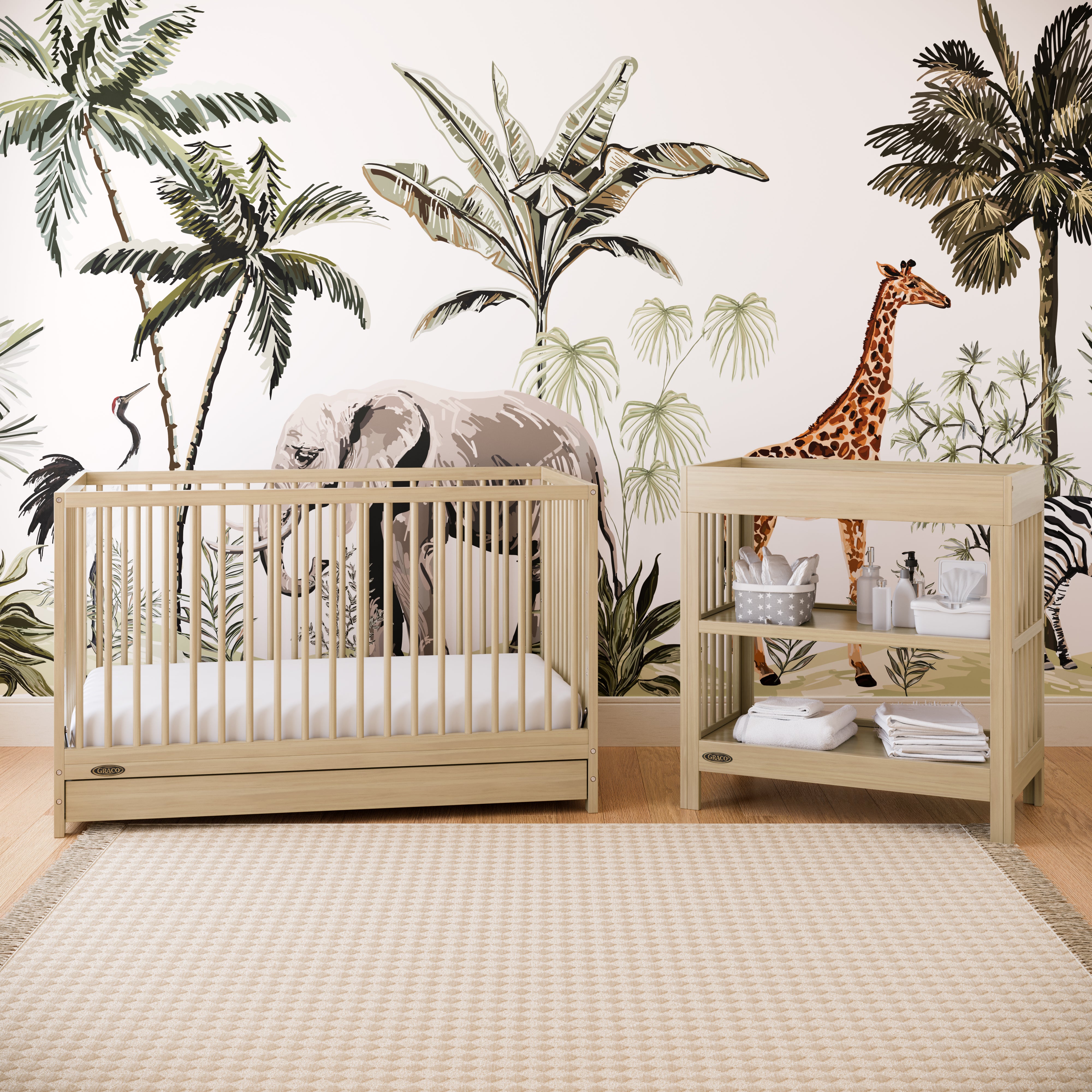 Graco® Teddi® Changing Table with Bonus Water-Resistant Changing Pad.
