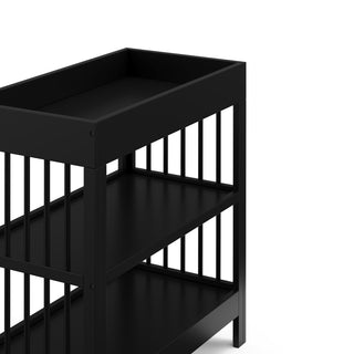 black changing table with two shelves