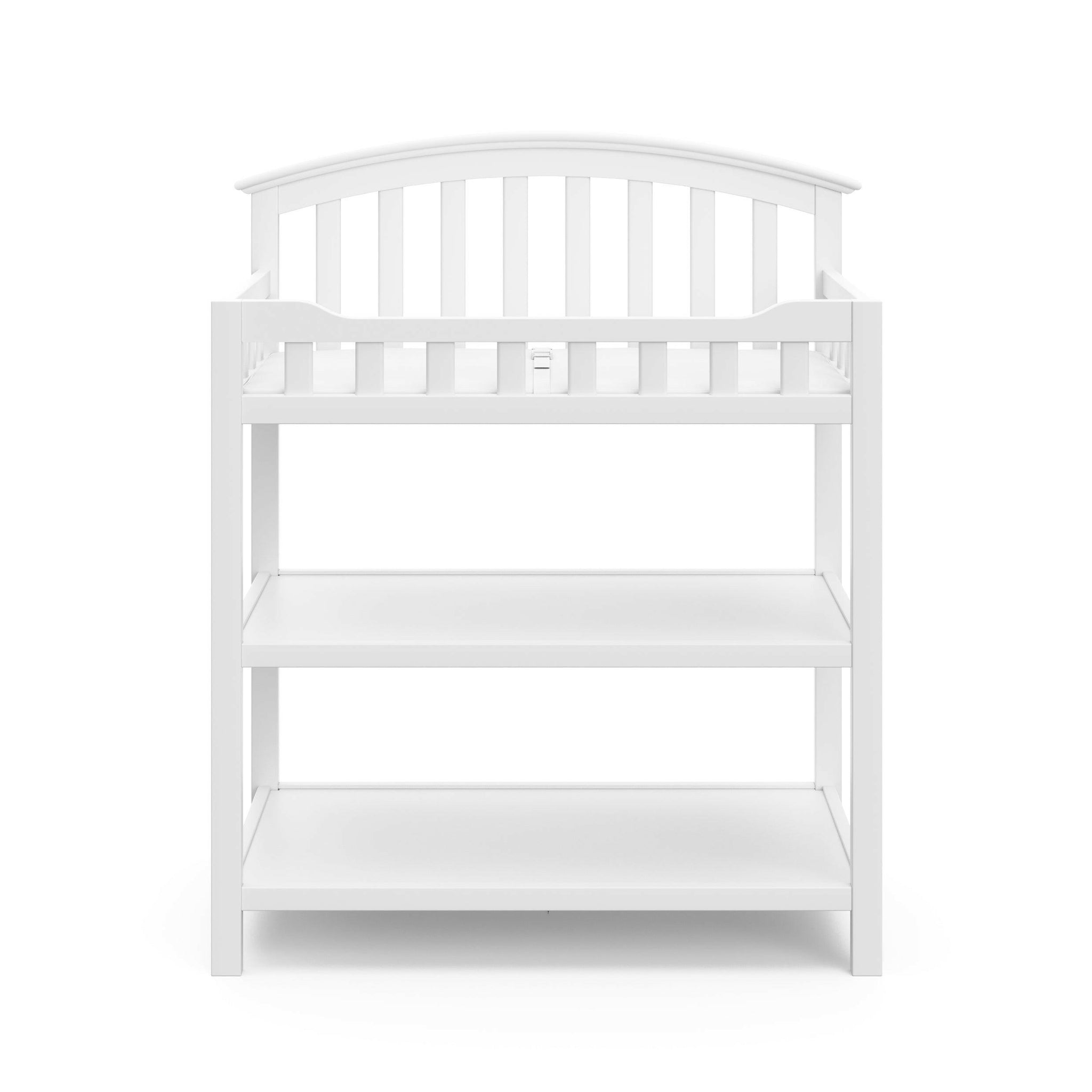  Front view of white changing table with two open shelves