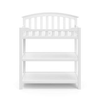  Front view of white changing table with two open shelves