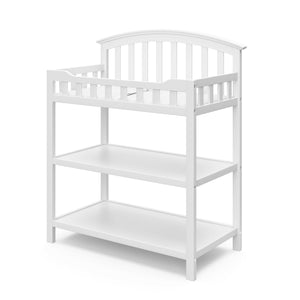 White angled changing table with two open shelves