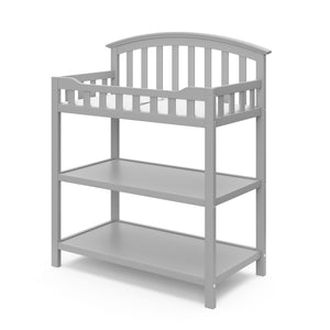 Pebble gray angled changing table with two open shelves