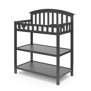 gray angled changing table with two open shelves