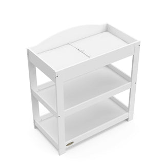 Bird’s-eye view of white changing table with removable headboard and two open shelves