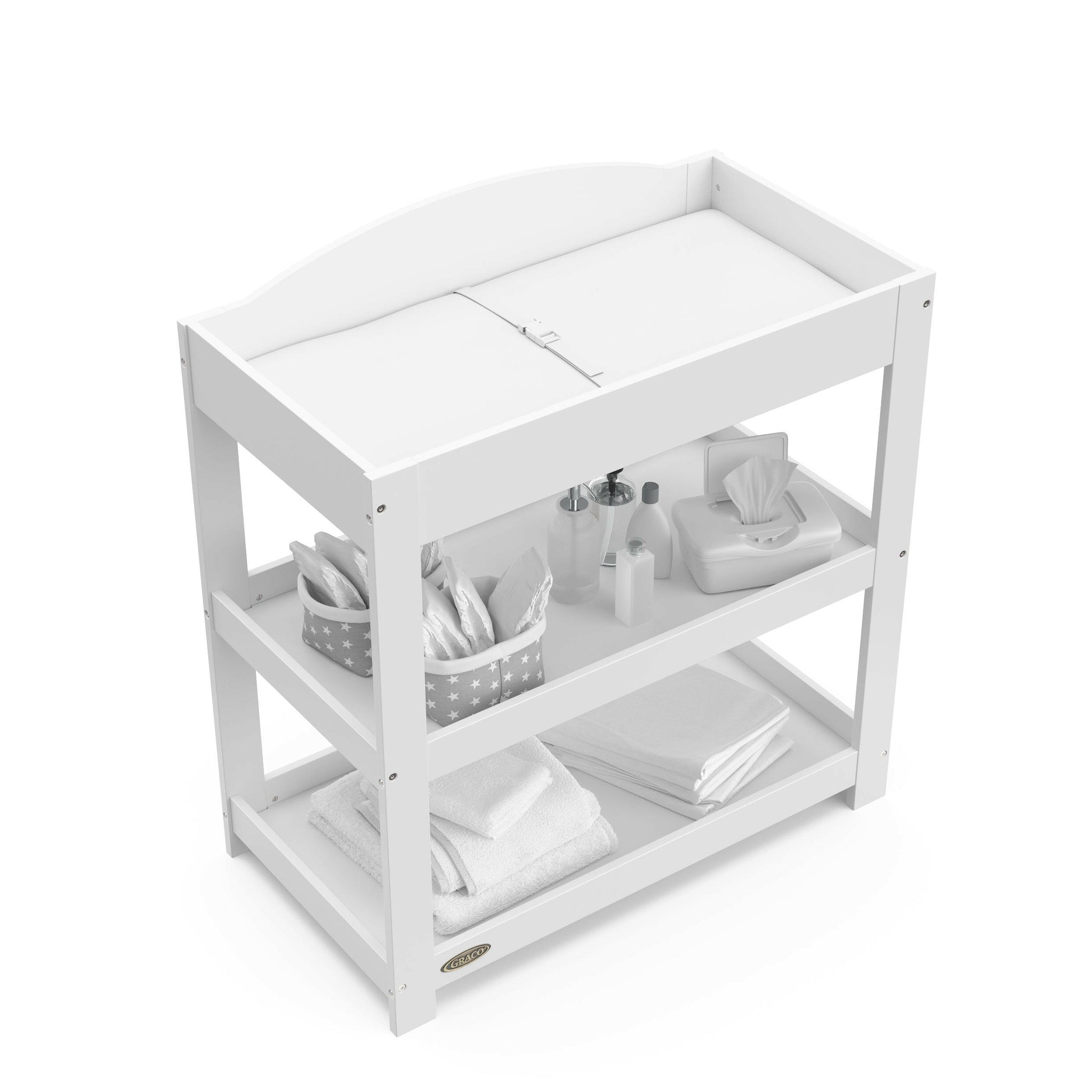 Bird’s-eye view of white changing table with removable headboard and two open shelves