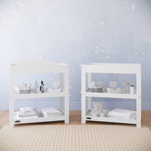 white changing table with removable headboard and two open shelves in nursery 