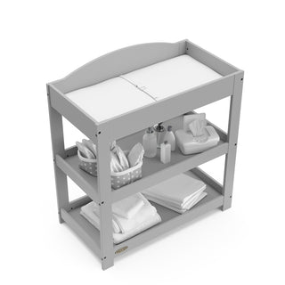 Bird’s-eye view of Pebble gray changing table with removable headboard and two open shelves