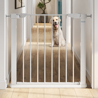 white safety gate installed on wall for dogs