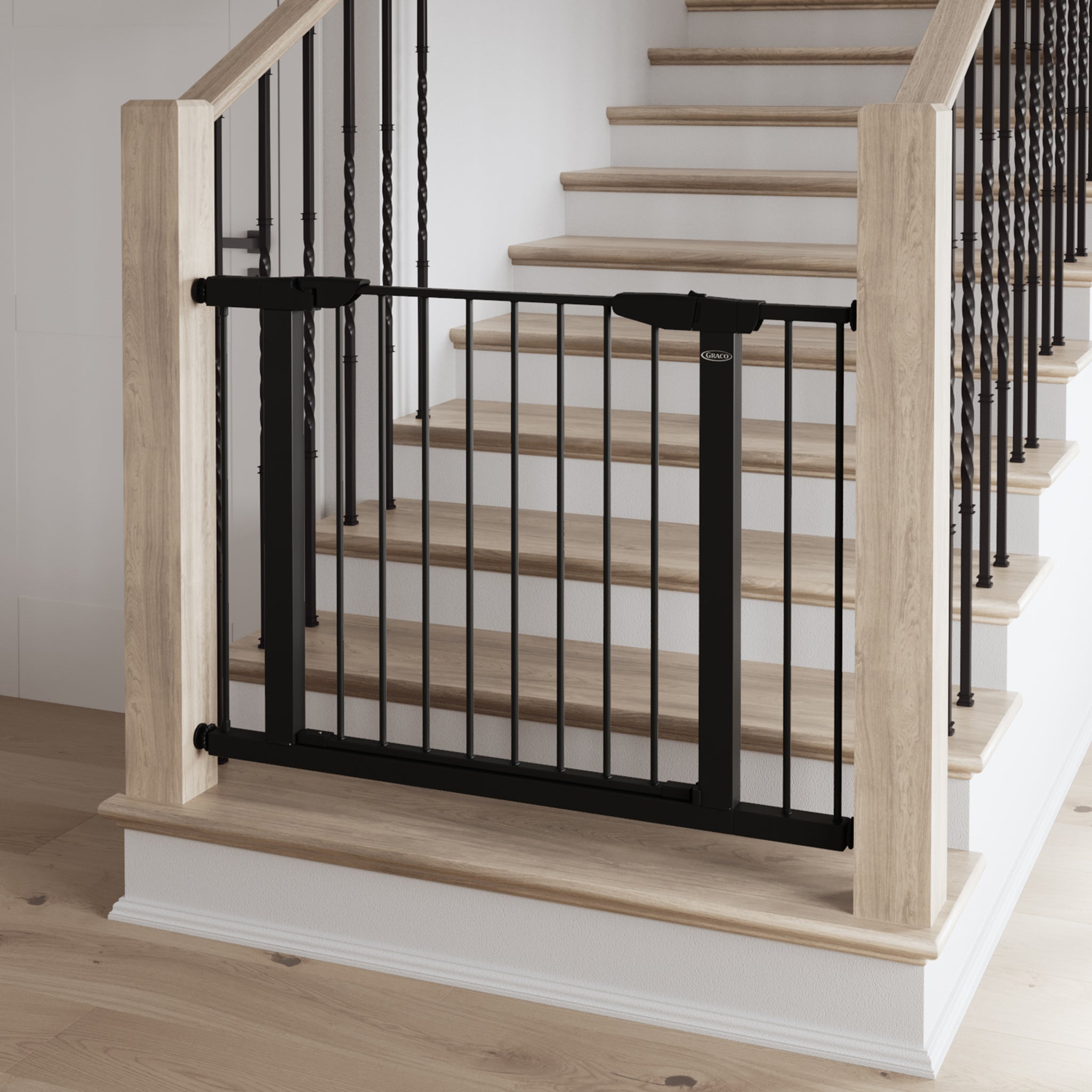 black safety gate installed in stairs