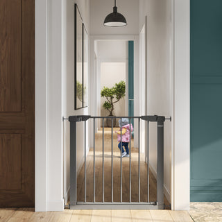 gray safety gate installed on wall for toddlers