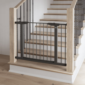 gray safety gate installed in stairs