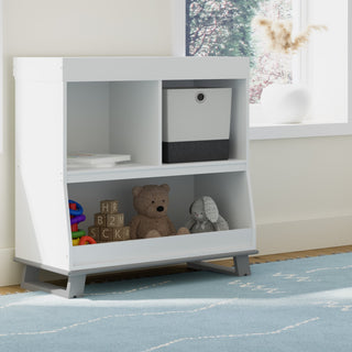 Pebble gray angled changing table with storage in nursery