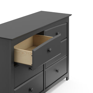 gray 6 drawer dresser with open drawer close-up view
