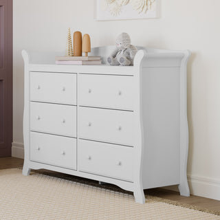 White 6 drawer dresser in nursery