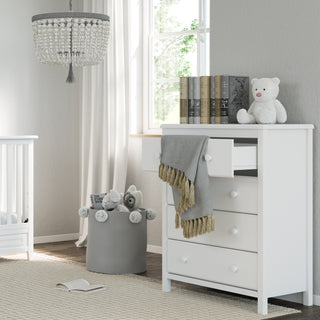 White 4 drawer chest in nursery