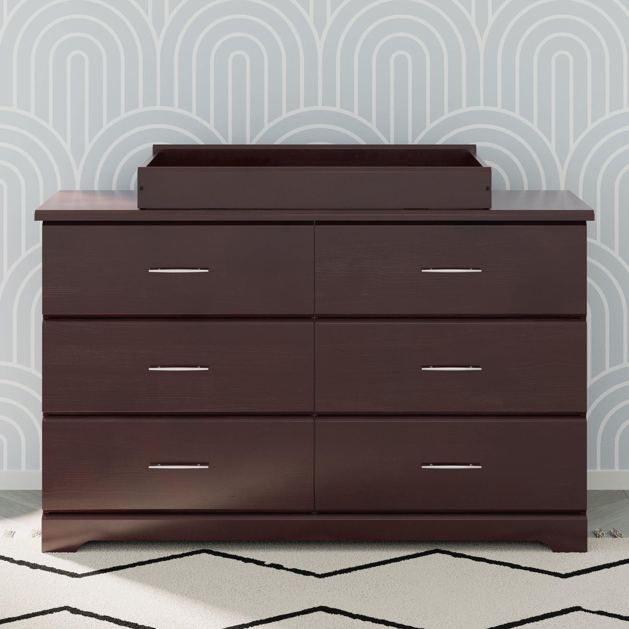 espresso changing topper on top of 6 drawer dresser in nursery 