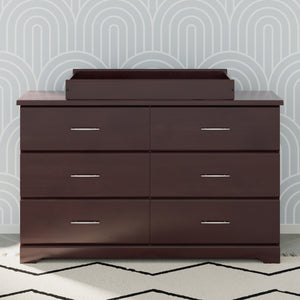 espresso changing topper on top of 6 drawer dresser in nursery 