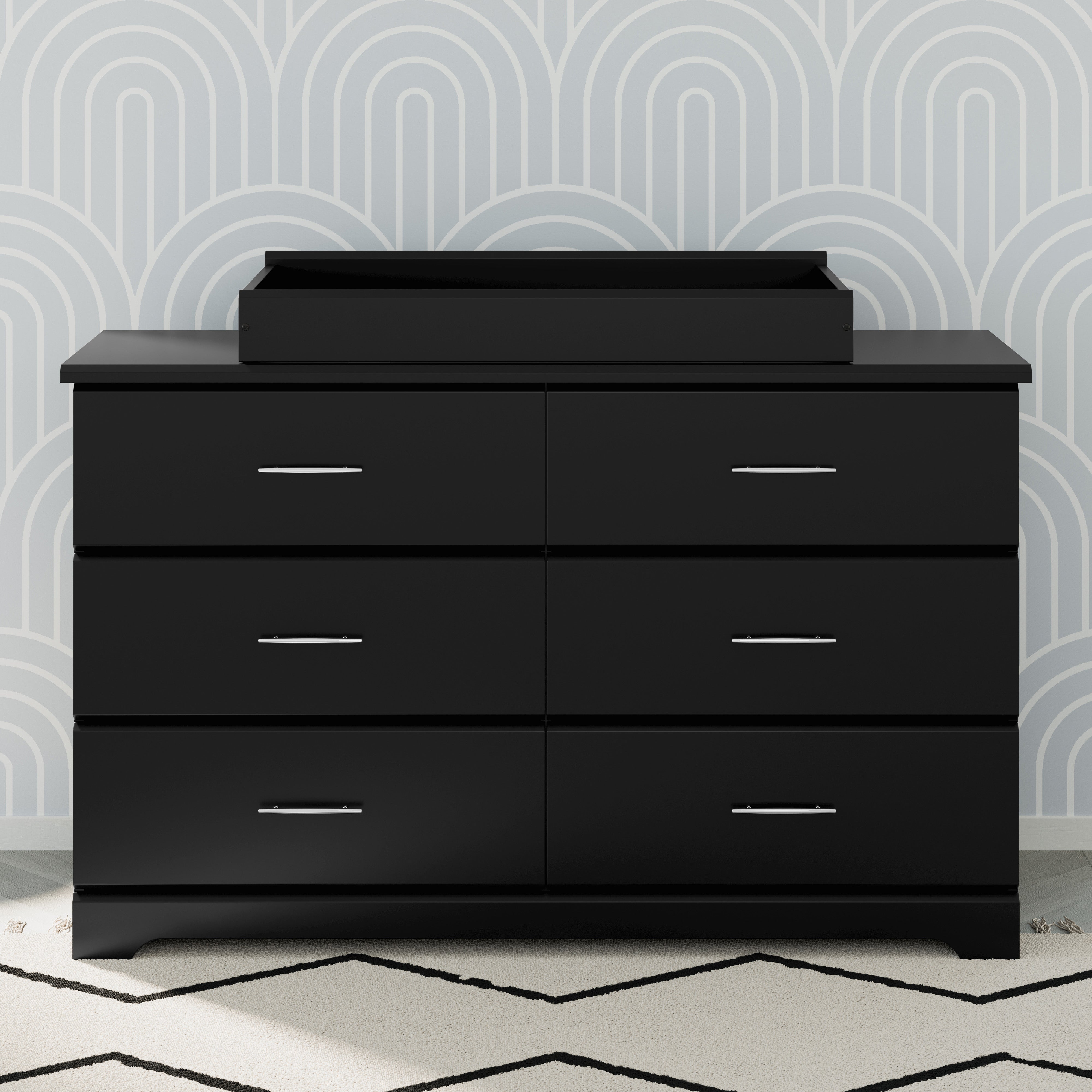 Black 6 drawer dresser in nursery