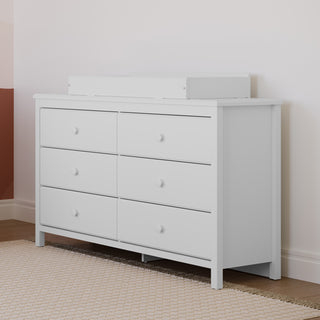 White 6 drawer dresser in nursery